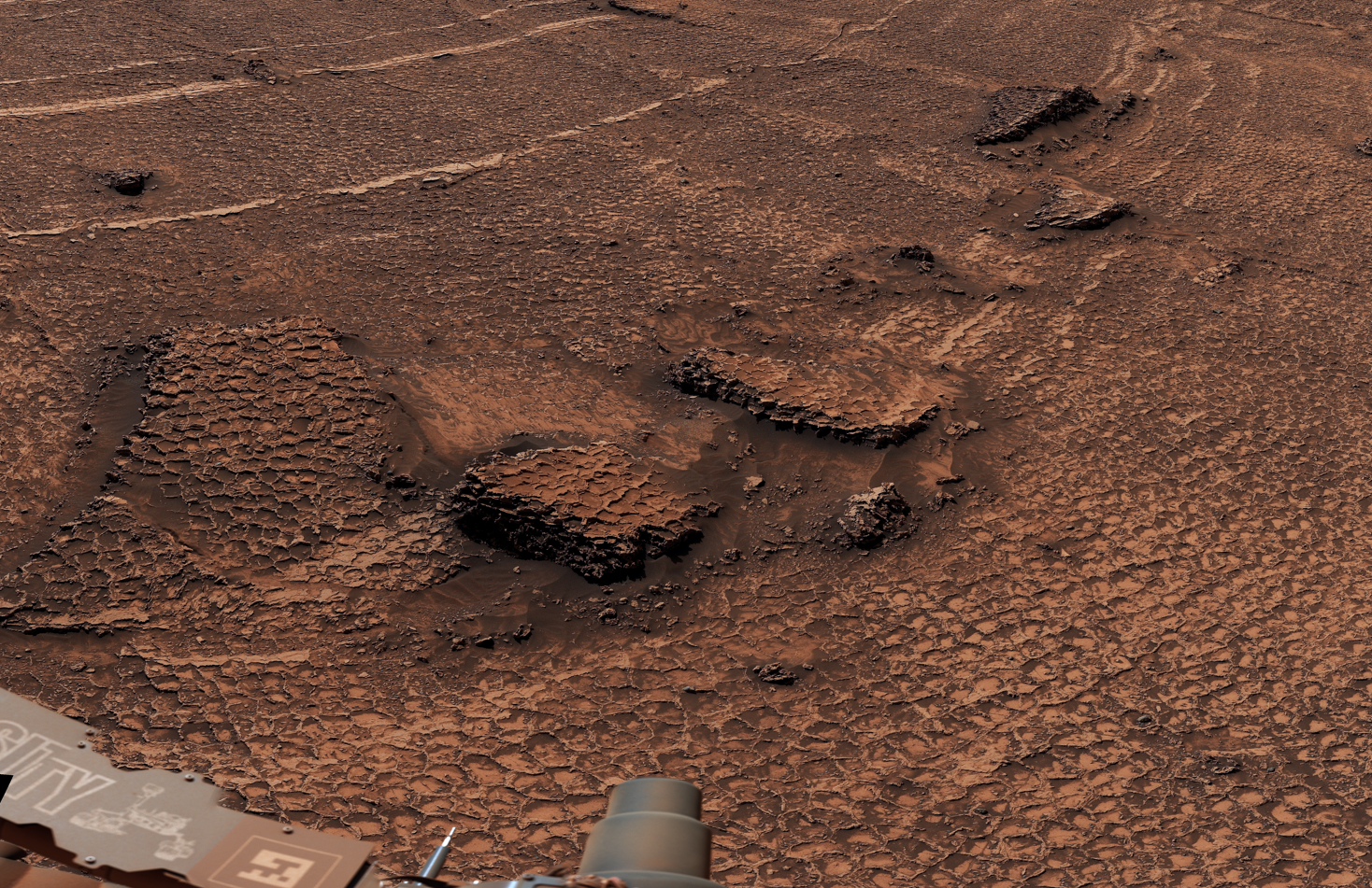 Close-up of honeycomb-textured polygon fractures on the Martian surface